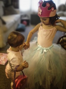 Kate's children playing in their small apartment.